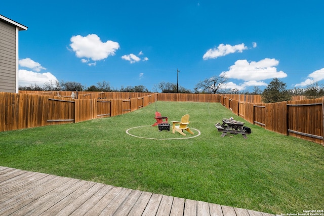 view of yard with an outdoor fire pit