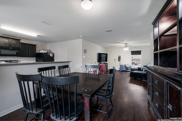 dining space with ceiling fan and dark hardwood / wood-style floors