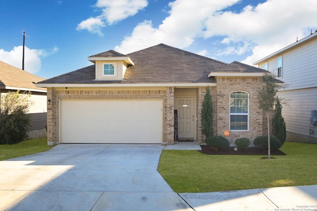 view of front facade featuring a front lawn and a garage