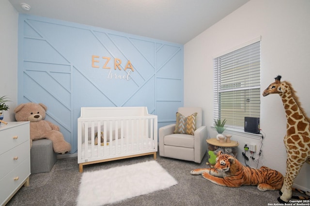 bedroom with carpet flooring and a nursery area