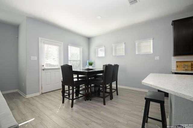 dining space featuring light hardwood / wood-style floors