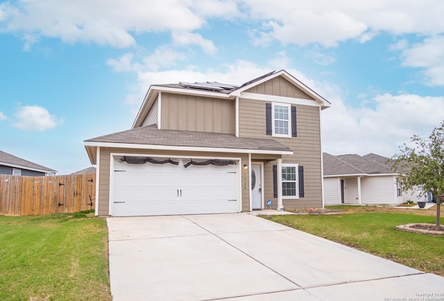 view of front of home with a garage, a front yard, and solar panels