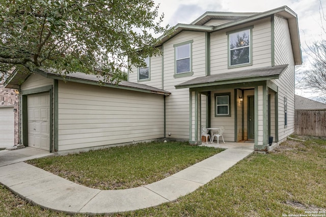 front facade with a garage and a front lawn