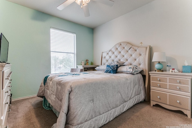 bedroom with light carpet and ceiling fan