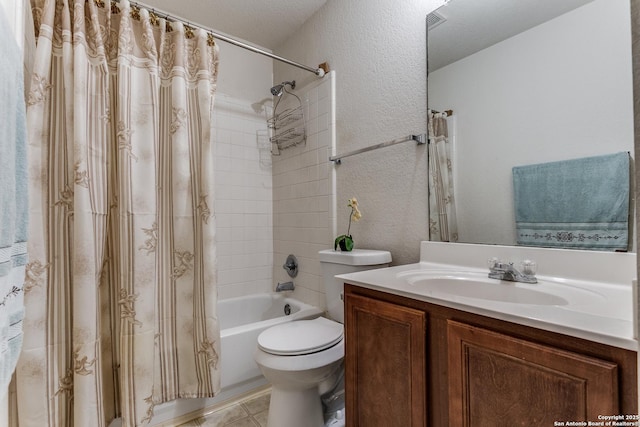 full bathroom with toilet, vanity, tile patterned floors, shower / tub combo, and a textured ceiling