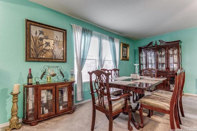 dining room with light carpet