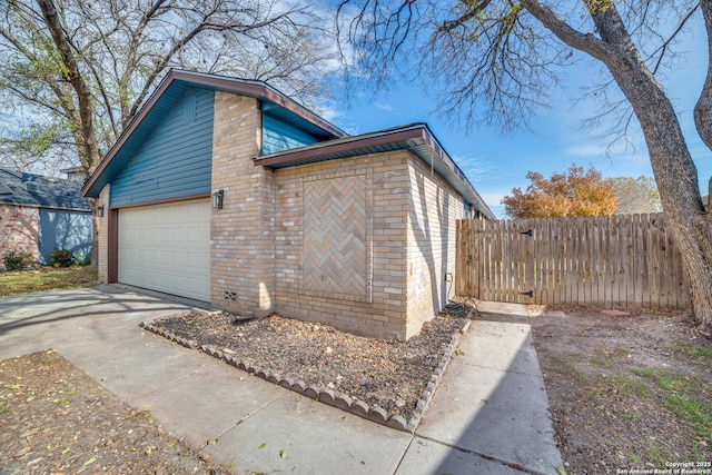 view of property exterior featuring a garage