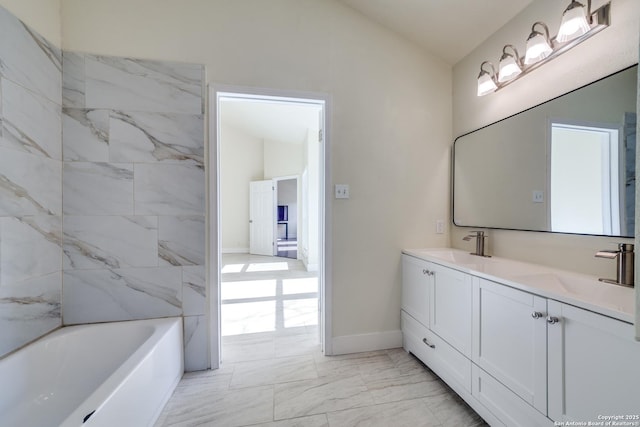 bathroom featuring vanity and vaulted ceiling