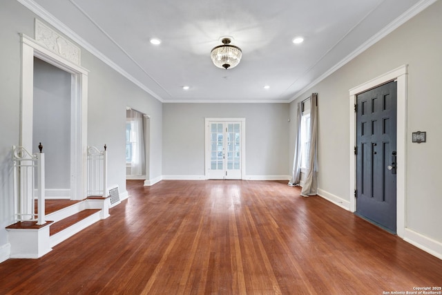 foyer featuring crown molding and hardwood / wood-style flooring