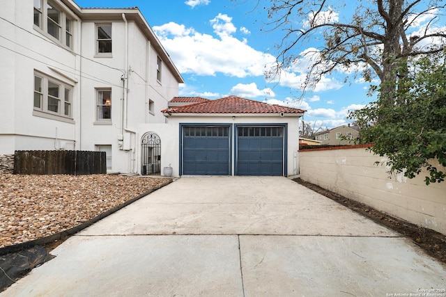 view of side of home with a garage