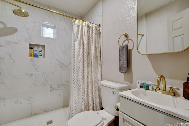 bathroom with toilet, vanity, and a shower with shower curtain