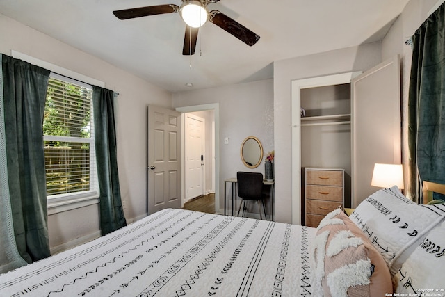 bedroom with ceiling fan, a closet, and hardwood / wood-style floors