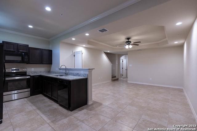 kitchen with kitchen peninsula, black appliances, a raised ceiling, crown molding, and sink