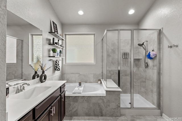 bathroom with vanity and plus walk in shower