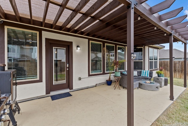 view of patio featuring an outdoor living space with a fire pit and a pergola