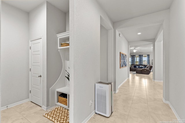 hallway featuring light tile patterned floors