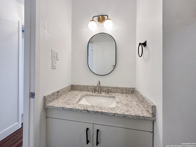 bathroom featuring hardwood / wood-style floors and vanity