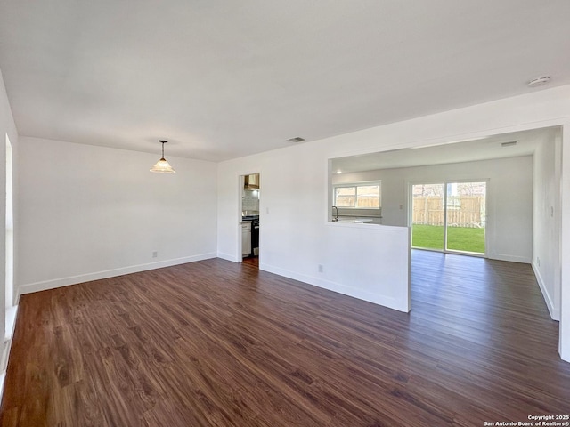 spare room featuring dark hardwood / wood-style floors