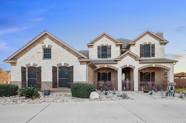 french provincial home with a porch