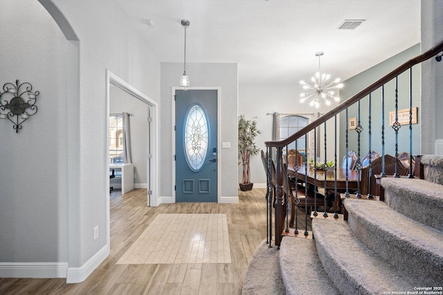 entrance foyer featuring a chandelier and light wood-type flooring