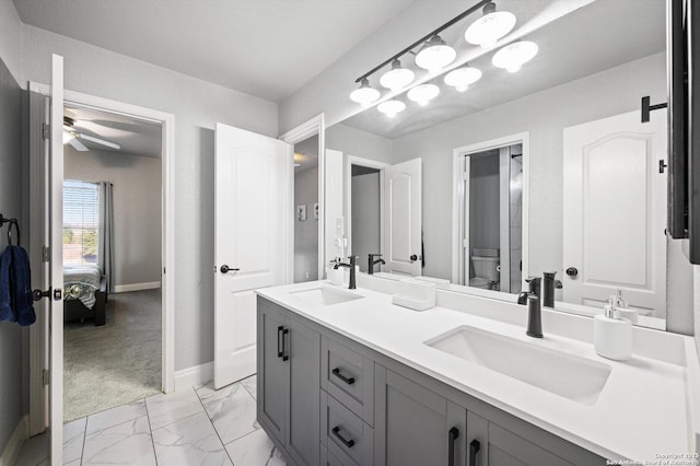 bathroom with ceiling fan, toilet, and vanity