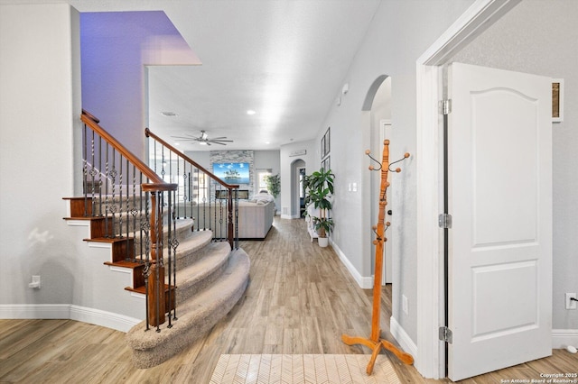 entryway featuring ceiling fan and hardwood / wood-style floors