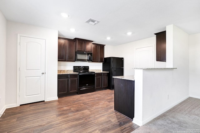 kitchen featuring kitchen peninsula, dark hardwood / wood-style flooring, light stone countertops, dark brown cabinetry, and black appliances