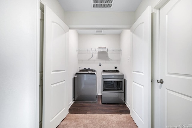 laundry area with washer and dryer and carpet floors