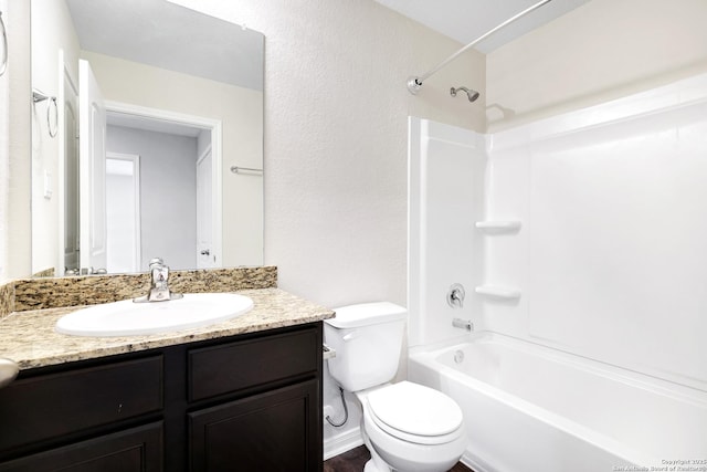 full bathroom with toilet, vanity, and bathtub / shower combination