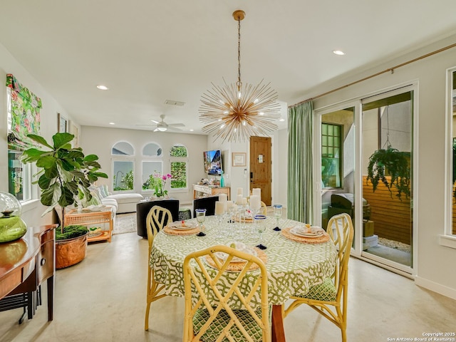 dining area with ceiling fan with notable chandelier