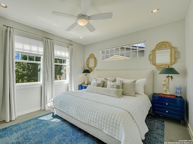 bedroom featuring ceiling fan and carpet