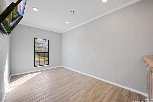 unfurnished room with light hardwood / wood-style flooring and ornamental molding