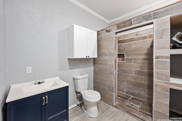 bathroom with walk in shower, vanity, toilet, and ornamental molding