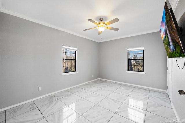 empty room with ceiling fan and ornamental molding