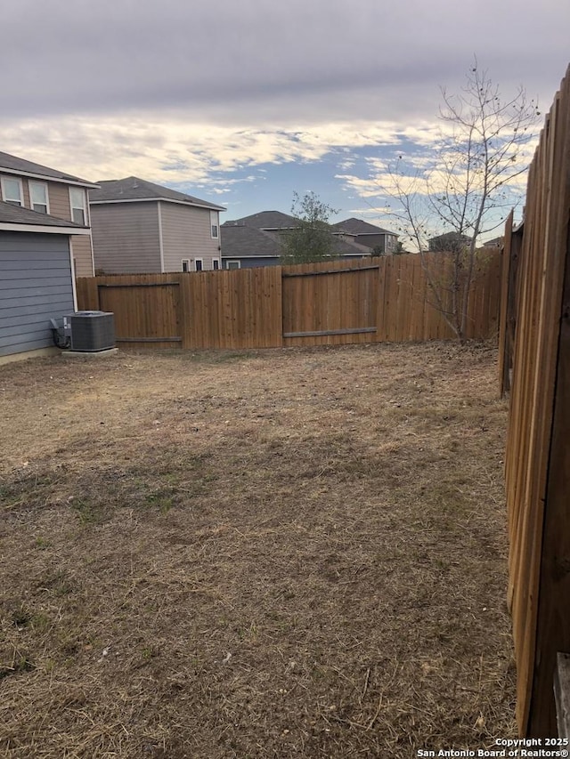 view of yard featuring central AC