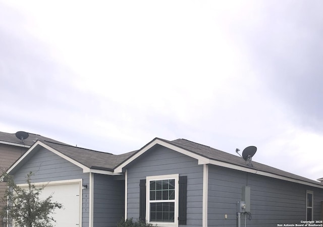 view of side of property featuring a garage