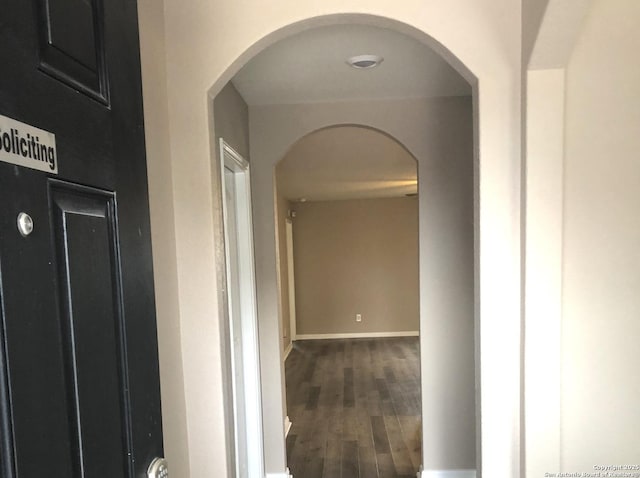 corridor featuring dark hardwood / wood-style floors