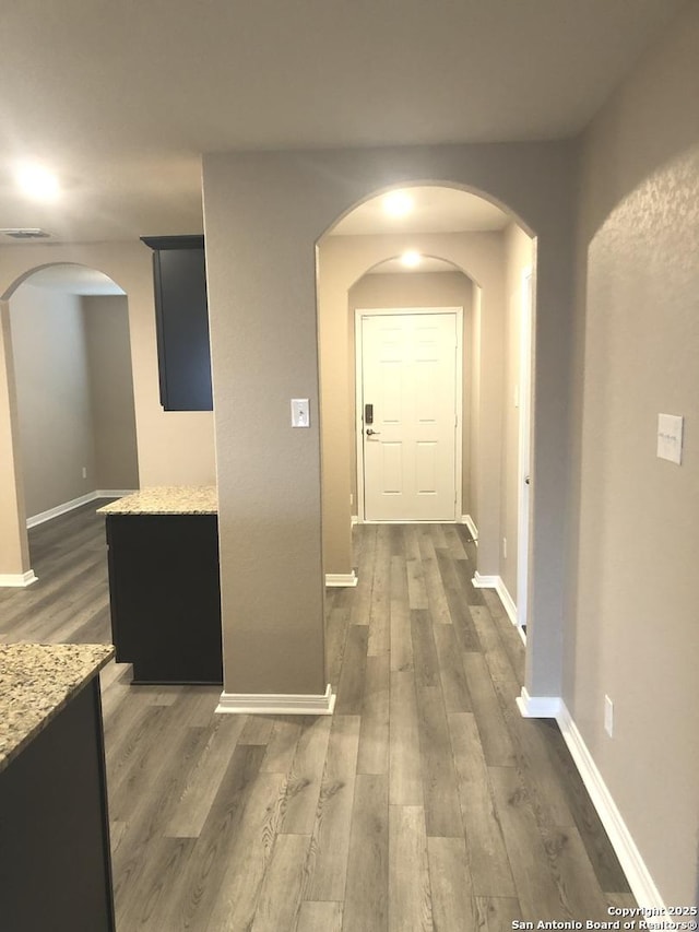 hall with dark hardwood / wood-style flooring