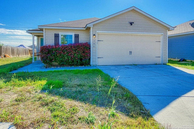 single story home with a front lawn and a garage