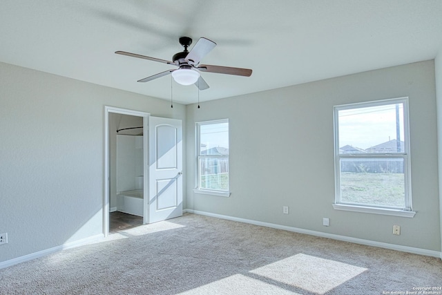 unfurnished bedroom featuring ceiling fan and light colored carpet