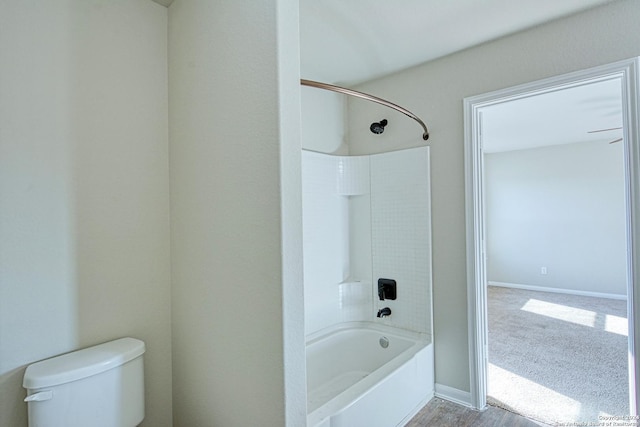 bathroom with shower / tub combination and toilet