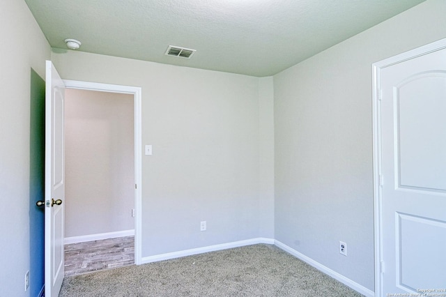 unfurnished room with carpet floors