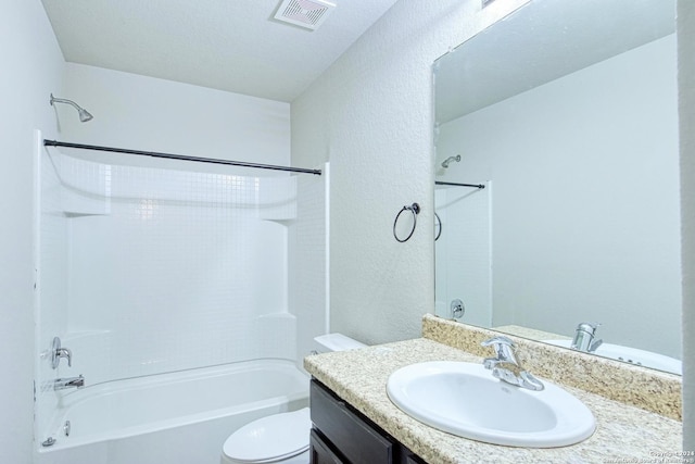 full bathroom featuring toilet, vanity, and shower / washtub combination