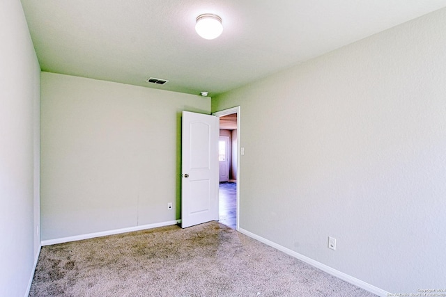 unfurnished room with carpet floors