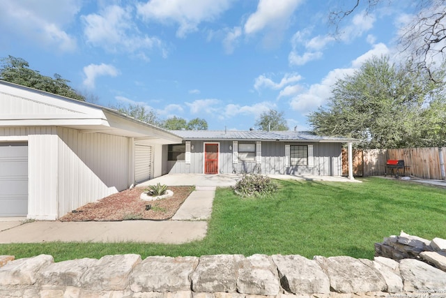 ranch-style house with a front lawn and a garage