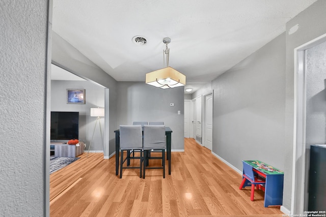 dining room featuring wood-type flooring