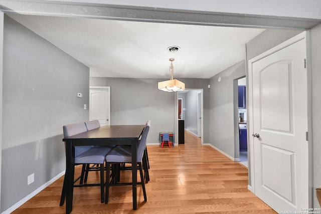 dining space featuring light hardwood / wood-style flooring