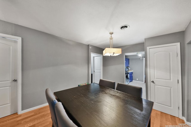 dining space featuring light hardwood / wood-style floors