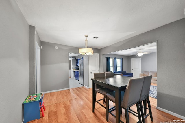 dining area featuring ceiling fan and light hardwood / wood-style floors