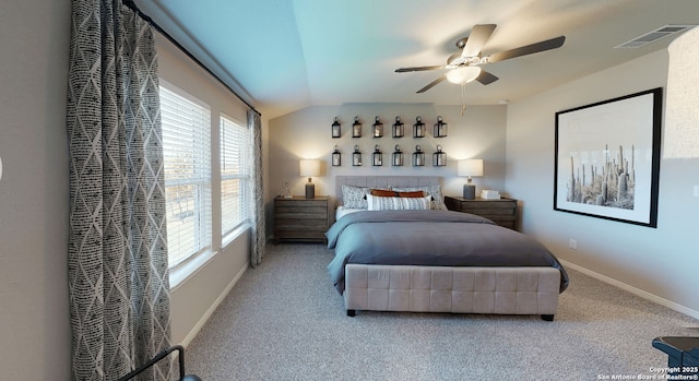 bedroom featuring ceiling fan, vaulted ceiling, and carpet floors